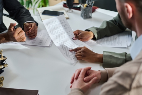 young couple reviewing documents with a lawyer