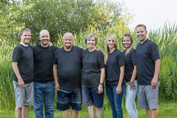 Large family smiling outdoors