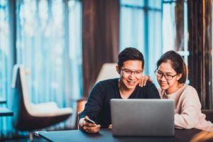 couple in front of laptop